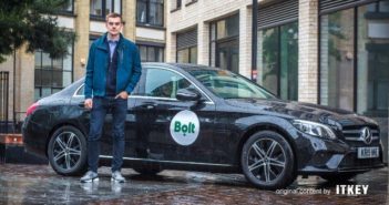 Bolt's CEO, Markus Villig, next to a company car